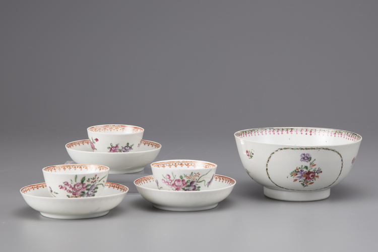 A Lowestoft bowl and three cups and saucers