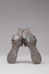 A pair of wood and silver hammam shoes