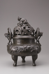 A Chinese bronze tripod censer and cover