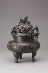 A Chinese bronze tripod censer and cover