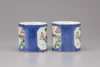 A pair of Chinese powder-blue and famille verte mugs