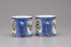 A pair of Chinese powder-blue and famille verte mugs