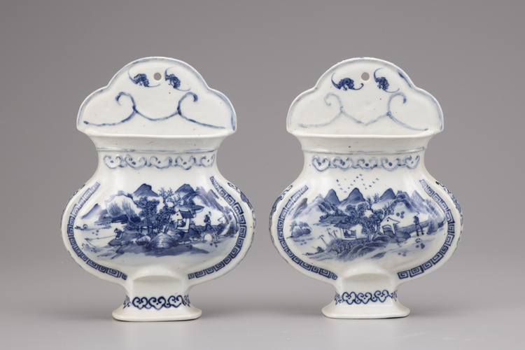 A pair of blue and white porcelain wall vases