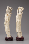 A pair of ivory standing figures of Meiren