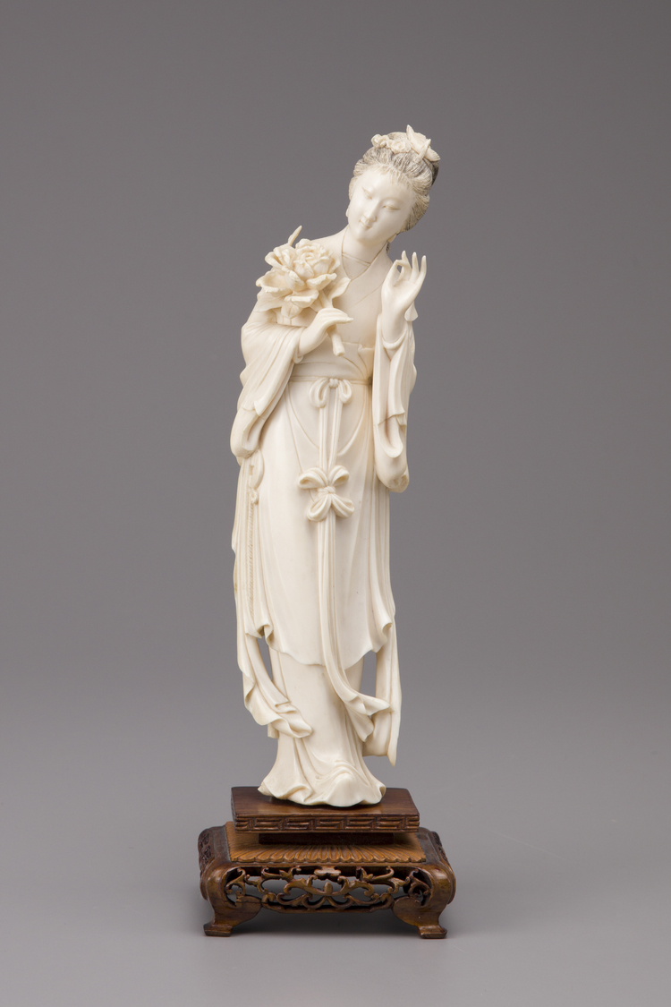 An ivory standing figure of a Meiren with wooden base