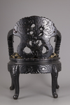 A pair of Chinese hardwood dragon chairs