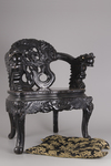 A pair of Chinese hardwood dragon chairs