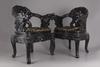 A pair of Chinese hardwood dragon chairs