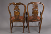 A pair of Chinese hardwood chairs with marble backrest