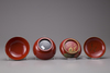 Ten Japanese red lacquered bowls with wooden box