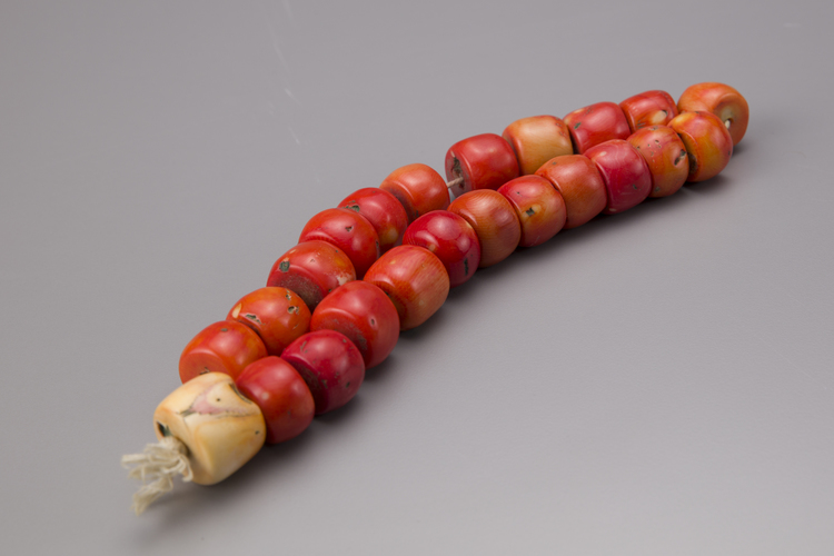 A blood coral prayer bead necklace