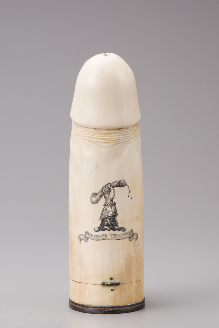 A carved ivory phallus