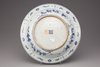 A blue and white porcelain dragon dish