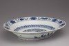 A blue and white porcelain dragon dish