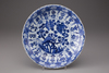 A blue and white porcelain plate with floral decorations