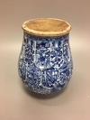 A large blue and white jar with cover