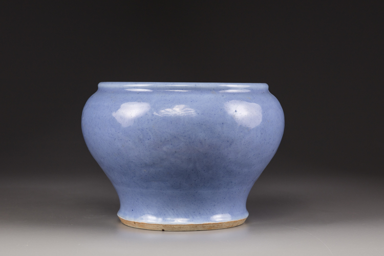 A light-blue-glazed jar