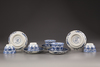 Five blue and white porcelain cups and saucers