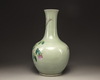 A Chinese celadon-ground famille rose bottle vase