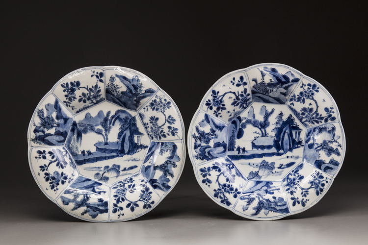 A pair of blue and white moulded plates