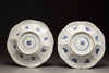 A pair of blue and white moulded plates
