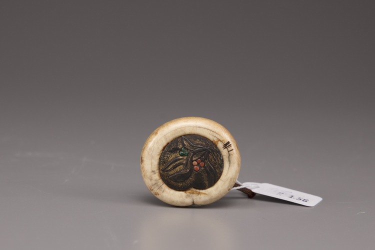 A Japanese Kagamibuta netsuke