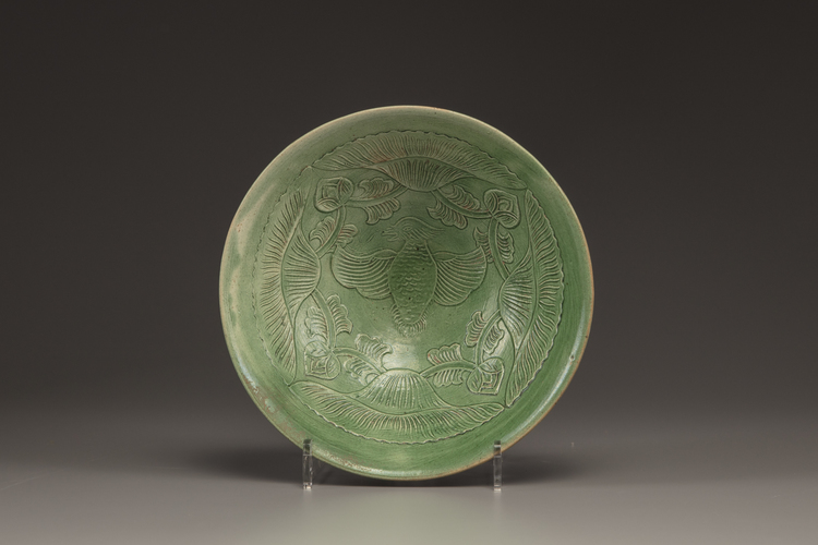 A CHINESE YAOZHOU CARVED GREEN GLAZED CONICAL BOWL, LIAO DYNASTY (907-1125)