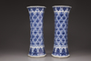 A pair of blue and white trumpet vases