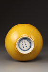 A yellow-glazed bottle vase