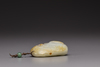 A white and russet jade 'melon' pendant