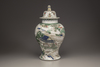 A famille verte baluster vase and a cover