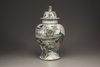 A famille verte baluster vase and a cover