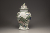 A famille verte baluster vase and a cover