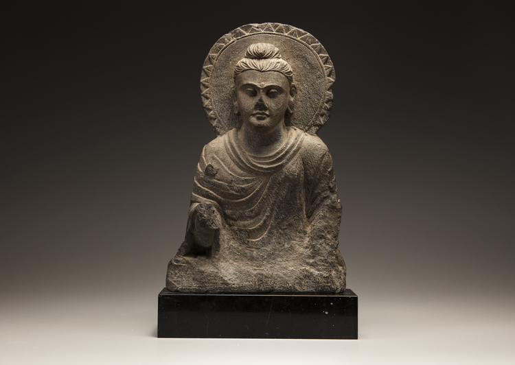 A Gandharan grey schist Buddha