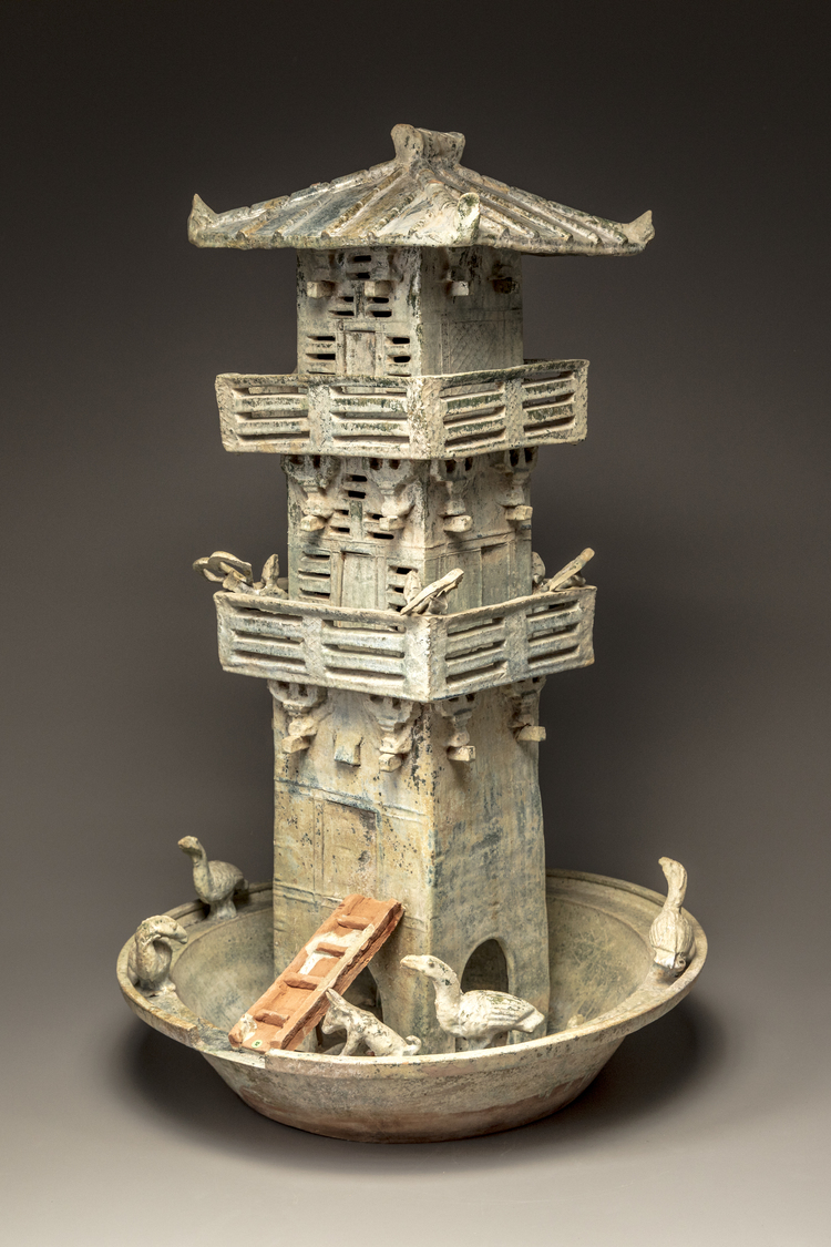 A green glazed pottery model of a watch tower