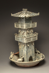 A green glazed pottery model of a watch tower