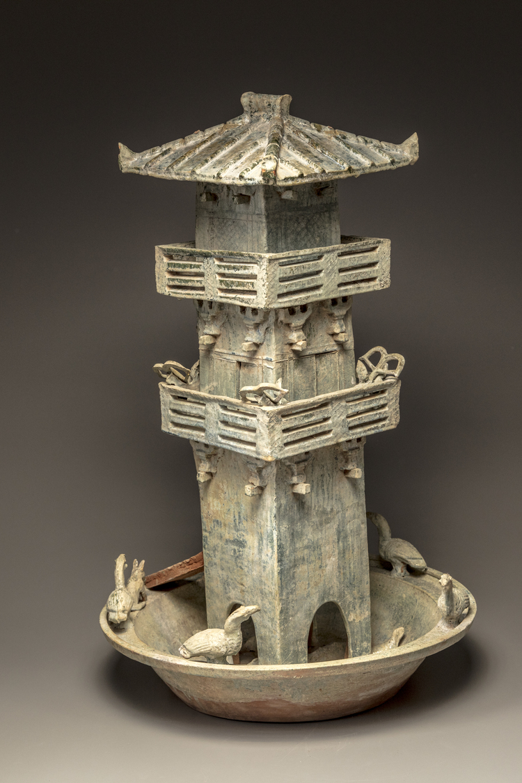 A green glazed pottery model of a watch tower