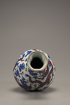 An iron-red-decorated blue and white trilobed vase