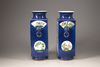 A pair of powder-blue-ground famille verte square-section vases, cong