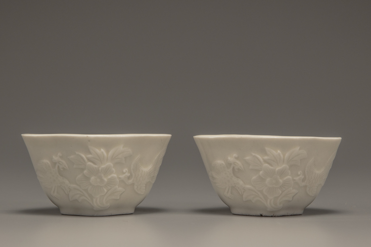 A pair of white-glazed lobed cups