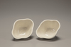 A pair of white-glazed lobed cups