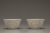 A pair of white-glazed lobed cups