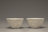 A pair of white-glazed lobed cups