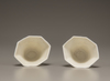 A pair of white-glazed octagonal 'prunus' cups