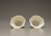 A pair of white-glazed octagonal 'prunus' cups