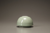 A small celadon-glazed water pot