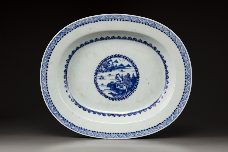 A large blue and white oval platter