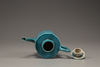 A turquoise-glazed wine pot and cover