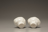 A pair of white-glazed libation cups