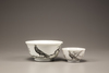 An en grisaille 'pheasant' tea cup and bowl